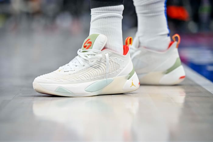 View of white and red Jordan Luka shoes.